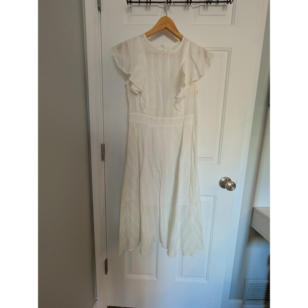 White eyelet dress with open back, tea length